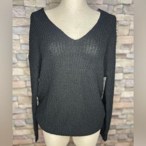 Mi Ami from Francesca’s black cropped V-neck sweater with beautiful twist back